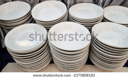 Pile of bowls on the buffet table.