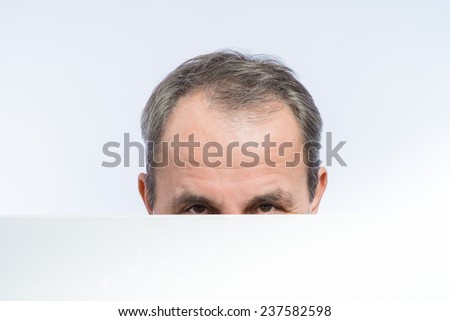 Businessman holding a poster