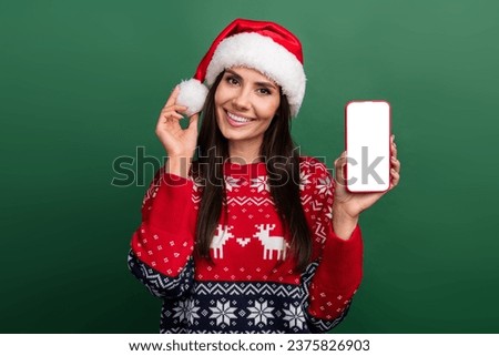 Photo of excited pretty woman elf wear x-mas pullover chatting apple samsung iphone device empty space isolated green color background