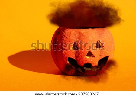  happy Halloween holiday background, Halloween Jack o Lantern pumpkin on orange background 
