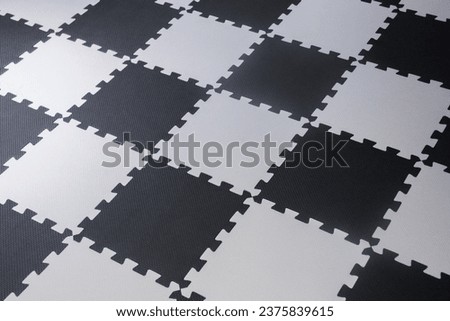 rubber tile floor, white and black checkered pattern.