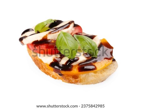 Delicious bruschetta with mozzarella cheese, tomatoes and balsamic vinegar isolated on white Royalty-Free Stock Photo #2375842985