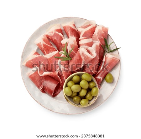 Plate with rolled slices of delicious jamon, olives and rosemary isolated on white, top view Royalty-Free Stock Photo #2375848381