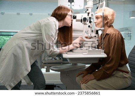 Specialist ophthalmologist uses a diopter meter in his work