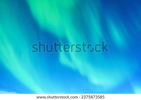 Sky background with northern lights. Aurora borealis. Northern lights as a background. Night winter landscape with aurora. Natural background.