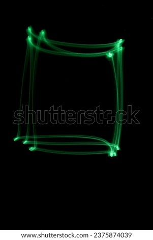 Neon light square shapes against dark background, long exposure technique photography, modern lines of light, abstract shapes