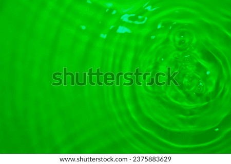 The green reflection of the water's surface is created by staining from a filter in a computer pro.