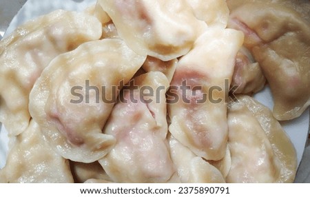 Photo of dumplings with strawberry. Home cooking. High quality stock photo.