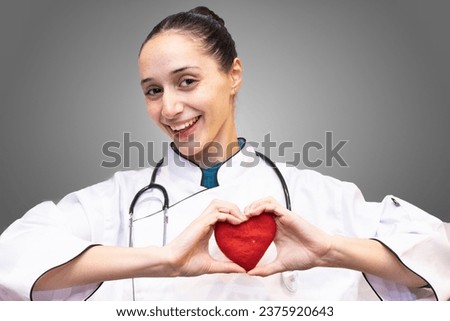 female cardiologist doctor with a healthy heart
