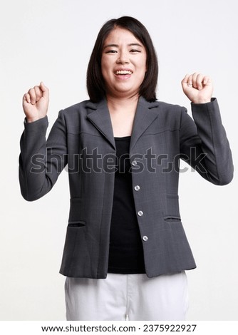Portrait studio isolated cutout closeup shot Asian young successful professional female businesswoman entrepreneur in formal suit with eyeglasses standing smiling look at camera on white background.