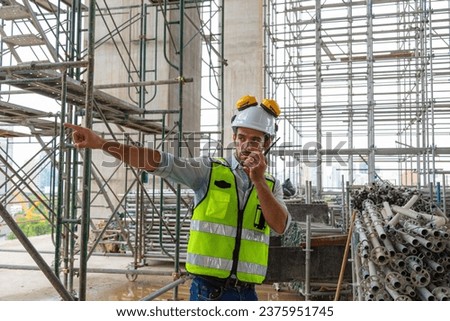 Portrait of an engineer designing a large project inspecting the job site to meet specifications.