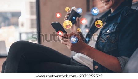 social network, social media, media, like, love, mail, online, messaging, communication, community. look at smartphone via one hand, and around that social media, love, like emotion spread out. Royalty-Free Stock Photo #2375959523