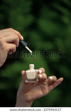 Promotional photo of nail polish in nature