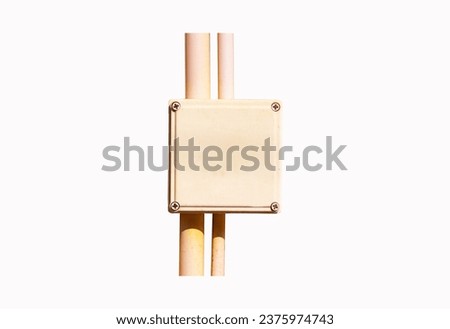 Box small plastic wiring with pipe yellow isolated on white background. Cables on Wires are secured with plastic ties. Conducting wiring. Electrical installation works. Electrical safety concept. Royalty-Free Stock Photo #2375974743