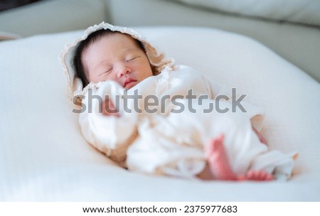 cute asian newborn baby in the room Royalty-Free Stock Photo #2375977683