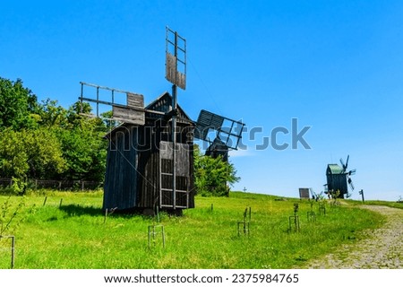 Old rustic wooden wind mill in Pyrohiv, Ukraine