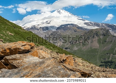 Panorama mountain summer landscape. Summer mountain landscape. Beautiful landscape with high mountains, blue sky with white clouds. Amazing scene with mountains