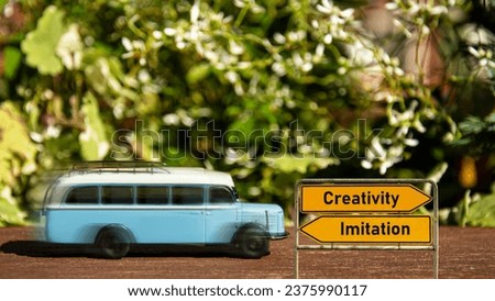 Street Sign the Direction Way to Creativity versus Imitation Royalty-Free Stock Photo #2375990117