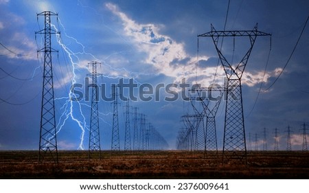 High voltage power line with amazing lightning Royalty-Free Stock Photo #2376009641