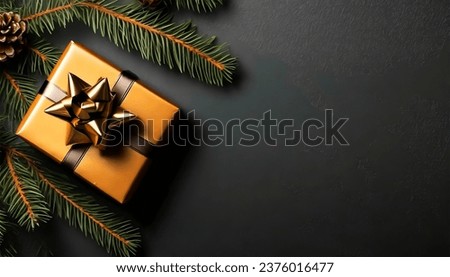 Customizable creative content set against a black backdrop, showcasing a gift wrapped in an elegant manner and accompanied by vibrant fir branches Royalty-Free Stock Photo #2376016477