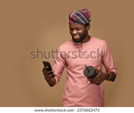 Emotional surprised African American guy with low prices in web store receiving a message with promo code, excited dark skinned hipster guy in trendy hat overjoyed with winning online contest on web