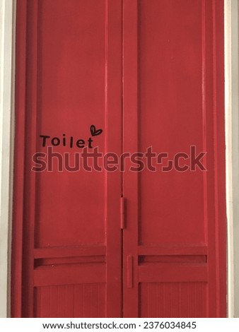 Red vintage closed toilet door