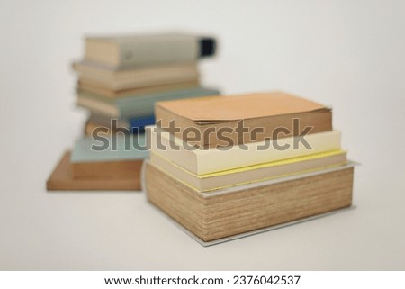 Stack of books on white education school