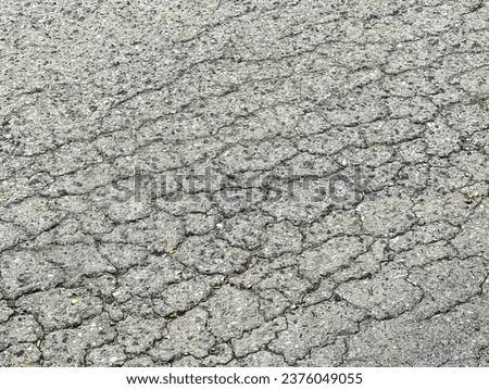 cracked asphalt with a crack in it.