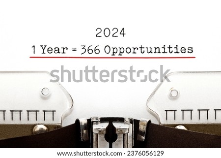 Inspirational quote 1 Leap Year 2024 equal to 366 opportunities typed on vintage typewriter. One more day to achieve your goal. Royalty-Free Stock Photo #2376056129