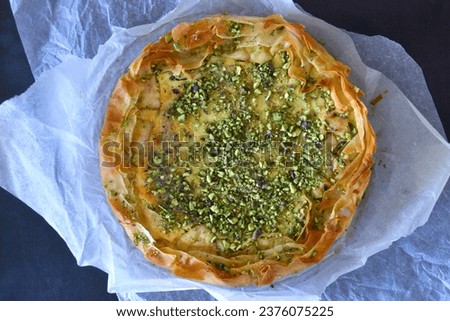 baklava cheesecake aerial picture, delicious aerial filo pastry filled with cheesecake and pistachio baklava 