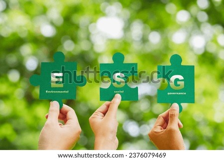 ESG concept ,Hand of human holding piece Jigsaw puzzle Sustainable development goal (SDGs) Ideas business based Global communication network