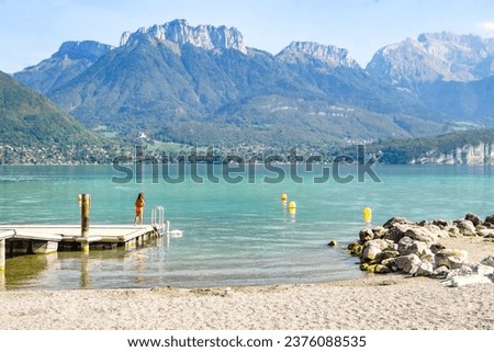 Annecy lake in France with turquoise water, mountains and swans