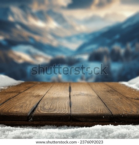 wooden desk cover of snow and frost with landscape of winter Alps. Christmas magic time. 