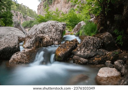 Koprulu Canyon in Antalya. Water flowing naturally into the lake through the stones and rocks. Natural waterfall.Antalya,Turkey.