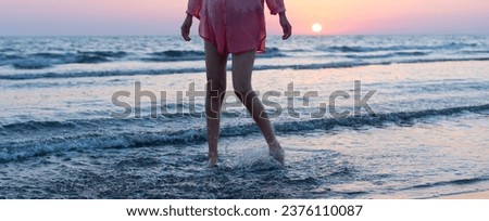 young woman at the beach , sunset time