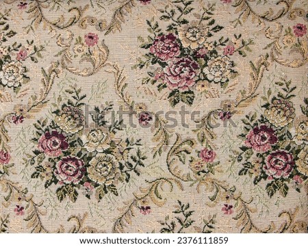 Beige fabric with floral pattern. Furniture jacquard fabric with flowers in geometric style. Royalty-Free Stock Photo #2376111859