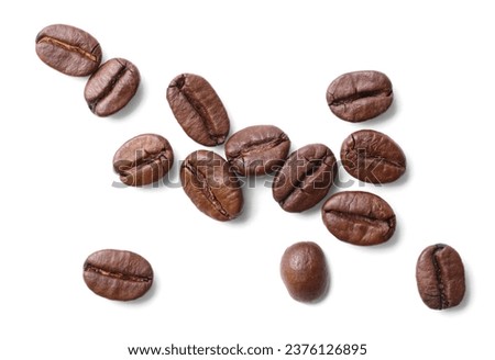Many roasted coffee beans isolated on white, top view Royalty-Free Stock Photo #2376126895