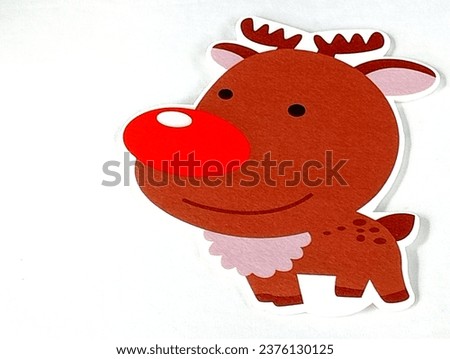 Reindeer foam paper stickers placed on a white background. Close -up shot of the reindeer.