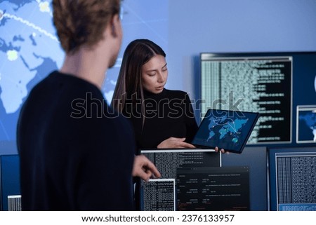Cyber security team working in a Cyber Security Operations Center SOC to protect systems and technologies Royalty-Free Stock Photo #2376133957