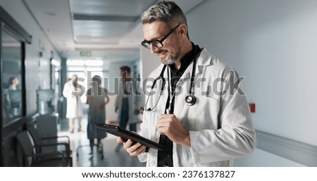 Doctor, hospital and tablet for medical information, typing and management of online charts or results. Healthcare worker, man or expert with digital technology for health services, planning and data
