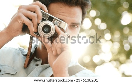Camera, photography or face of man in park on holiday vacation trip for creativity, shooting or tourism memory. Photographer, travel or male tourist with pictures for sightseeing in nature in summer