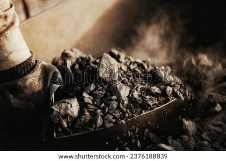 An  asian young construction man or boy working on the site. Aligning bricks on the floor. Copy space. Blurred background. 