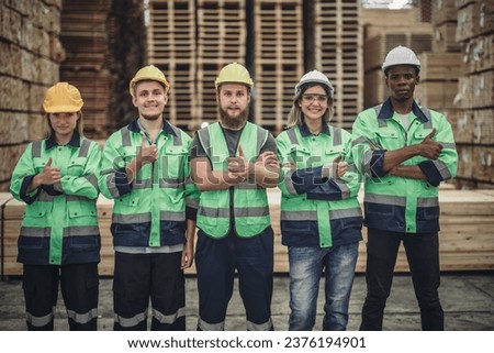 Shot of Wood Turners team building to measure, calculate right size of workpiece using hand and power tools. Cut, shape, rotate, smooth, balance wood fixtures based on requirements. Celebrate job done Royalty-Free Stock Photo #2376194901