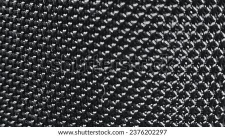Close-up of a black carbon fiber background. High quality photo