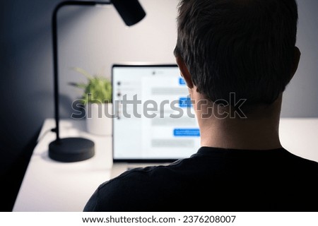 Love scam and romance fraud with messages. Online chat catfish with fake identity. Infidelity, cheating husband with secret relationship. Fraudster, swindler, scammer or cheater with laptop computer. Royalty-Free Stock Photo #2376208007