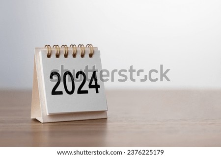 2024 Happy New year background. Turns over a calendar sheet. Setup objective target business cost and budget planning of new year concept. year change from 2023 to 2024.	 Royalty-Free Stock Photo #2376225179