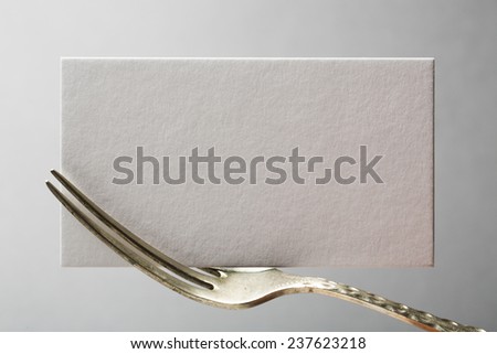 blank business card or invitation on fork