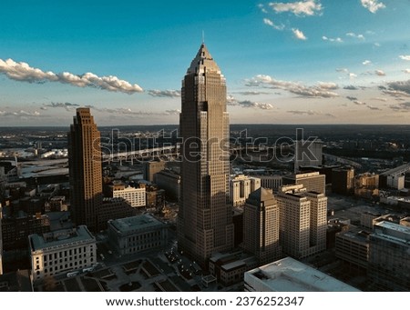 An aerial view of the Cleveland city skyline at sunrise.