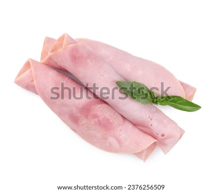 Rolled slices of tasty ham and basil isolated on white, top view Royalty-Free Stock Photo #2376256509