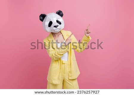 Photo of funky funny lady wear yellow jacket suit bear mask pointing two fingers empty space isolated pink color background Royalty-Free Stock Photo #2376257927